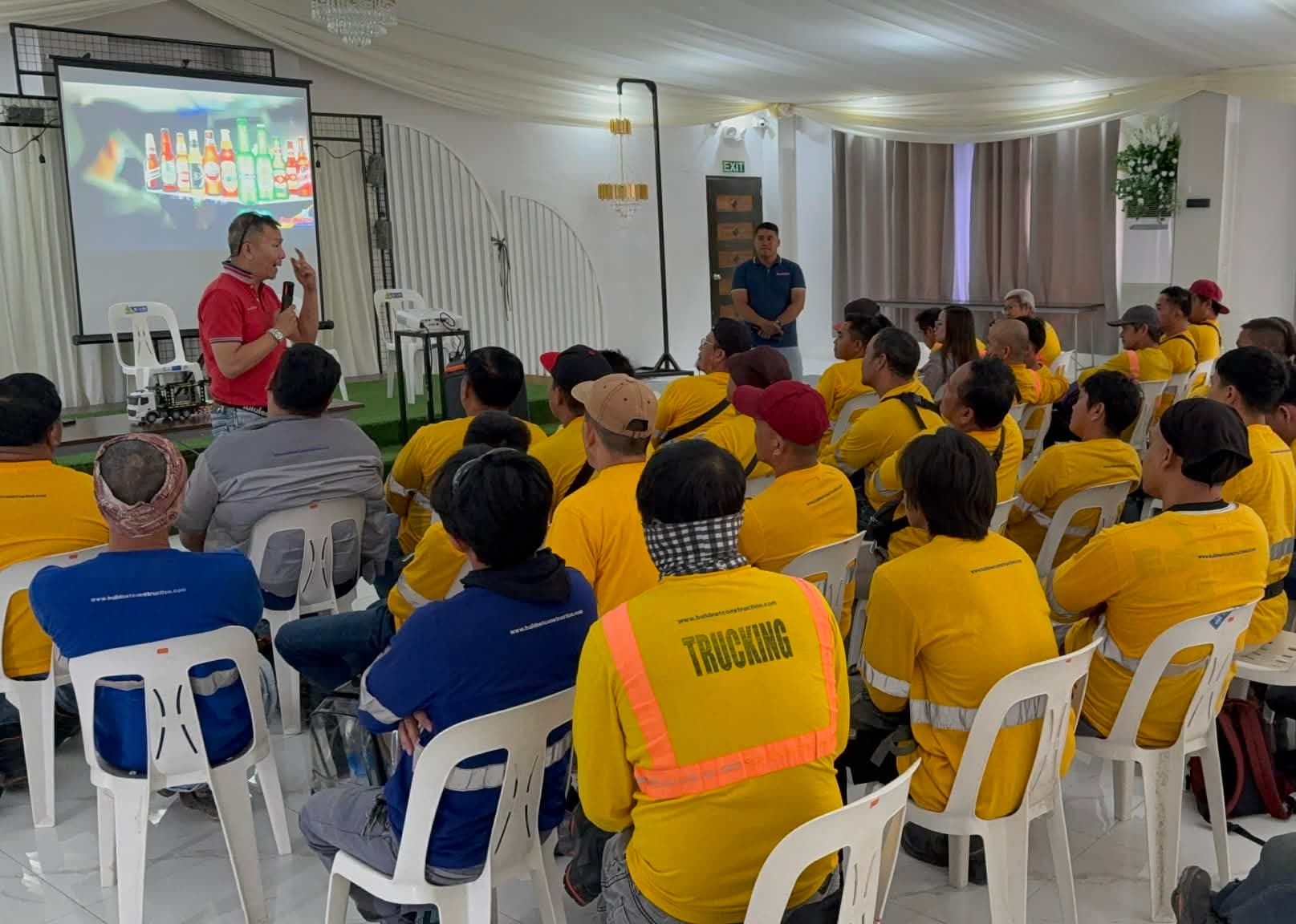 A PDSA instructor leading a classroom session for truck drivers